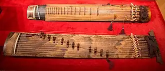 Geomungo and gayageum instruments on display in a museum