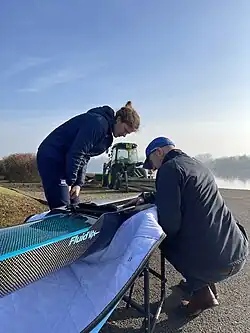 Georgina Brayshaw taking delivery of a new boat at the Redgrave Pinsent Rowing Lake in 2023