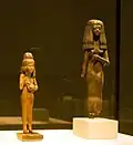 Figure of a girl with a cat and standing figure of a young woman, 18th Dynasty, c. 1380 and 19. Dynasty, Abusir el Meleq and Thebes