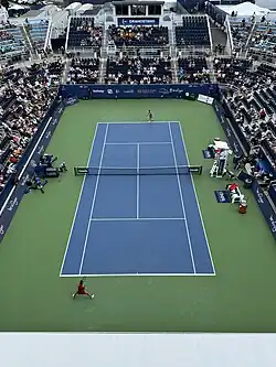 Elina Svitolina serving against Aryna Sablenka at Grandstand on August 16, 2024