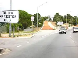 An arrester bed on Great Eastern Highway in Western Australia, located at the bottom of a hill before an intersection