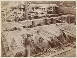 Workmen filling in tile vault domed ceilings