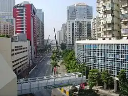 Curved city street, lined with high-rise buildings