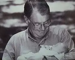 Image of Gunnar Stickler holding his granddaughter