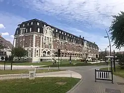 A photo of a brick hotel