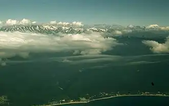 View from an aircraft in 1958. North side of Gagra, with the Abaata station and Zhoekvar river valley in the center. The city of Gagra itself is to the right.