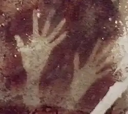 Cave of Pettakere, Bantimurung district (kecamatan), South Sulawesi, Indonesia. Hand stencils estimated between 0,000 years old[50]