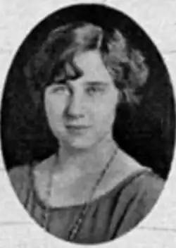A young white woman with bobbed wavy dark hair, in an oval frame