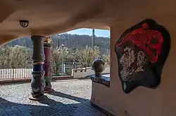 Passage to the inner courtyard with portrait of the artist