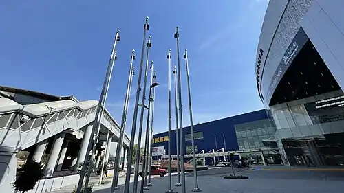Closeup of the fountain, Romero Rubio metro station entrance, and IKEA