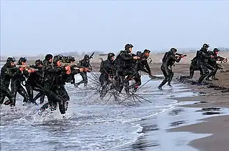 IRGCN frogmen equipped with T9 and Z-84 submachine guns in an amphibious exercise of Great Prophet IX war games exercise