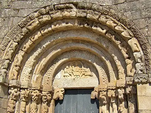 Tympanum of the church of São Salvador de Bravães, Christ surrounded by two of His disciples.