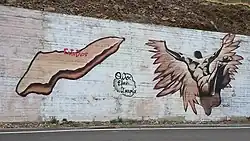 Modern street art of Icaria island and falling Icarus just outside the village of Evdilos on Icaria, Greece