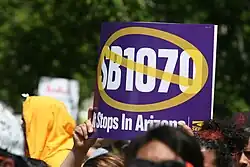 Photograph of a sign opposing SB 1070