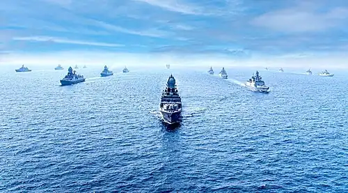 Smaller ships escorting two large ones