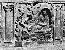 Buddhist artwork from Gandhara, Sikri Yusufzai stupa, 3rd-4th century A.D. Indra and his harpist visit the Buddha in Indrasala Cave.