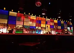 Photograph of an interior bar with colorful back lighting