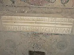 Marble inscription inserted in a mosaic