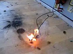 A short circuit caused by overvoltage destroys an integrated circuit.