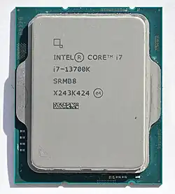 An silver, rectangular Intel Core i7 13700K microprocessor, as viewed from the top.