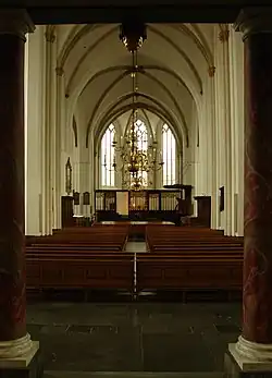 Stage and pews of a cathedral.