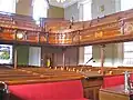 Interior view of the tiered gallery with decorative woodwork c 1880 at Plough Lane Chapel, Lion Street, Brecon.