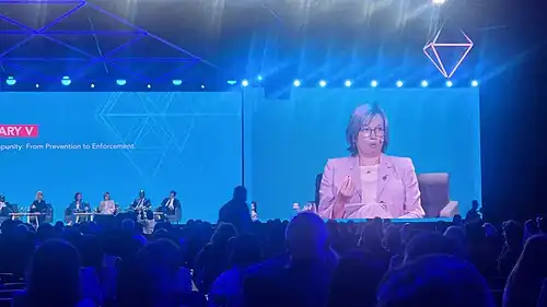 Catherine De Bolle on screen during IACC 2024 plenary session
