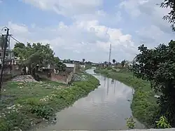 Jamuriya Nala (a brook) from Railway Station Road Bridge. This brook flows through the city and divides it into two halves.