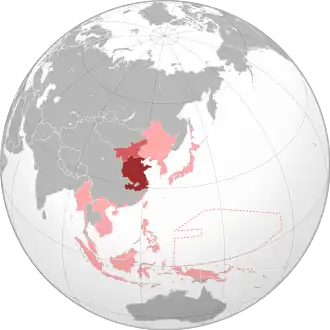 The Wang Jingwei regime (dark red) and Mengjiang (light red) within the Empire of Japan (pink) at its furthest extent