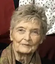 tight headshot of Roose, an older white woman with short hair