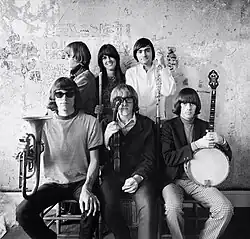 Jefferson Airplane photographed by Herb Greene at The Matrix club, San Francisco, in 1966. Top row from left: Jack Casady Grace Slick, Marty Balin; bottom row from left: Jorma Kaukonen, Paul Kantner, Spencer Dryden. A cropped version was used for the front cover of Surrealistic Pillow.