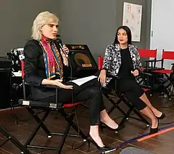 Julia Cumming interviewing Alexandria Ocasio-Cortez, New York Democratic Candidate for Congress (NY-14), at her "Anger Can Be Power" event at the Brooklyn Expo Center in Greenpoint, a part of BUST Magazine's "School for Creative Living", December 10th, 2017.