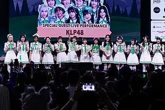 KLP48 in August 2024 L–R: Lucine, Yi Shyan, Amanda, Ann Drea, Yurina, Haruka, Cocoa, Salwa, Khalies, Suzuha, Tiffany, Devi, and Hillary