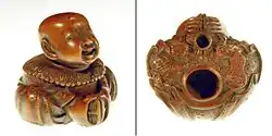 Katabori-netsuke front and rear view with two holes for cord