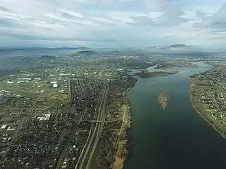 Aerial view of Kennewick from above the Columbia River near the Blue Bridge
