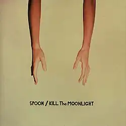 A left and a right forearm and hands extending down from the top of the frame