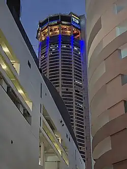 Komtar Tower, with the podium visible below and surrounded by low-rise buildings.