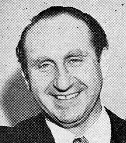 Face of a man smiling.