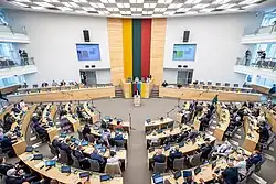 A large room with horseshoe-shaped seating, seen from above