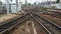 At exit of station (on the left stabling sidings for rolling stock. In the centre lines towards Lille and Paris. On the right locomotive depot.)