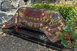 Tomb of Rudolf Nureyev draped in a mosaic oriental carpet sculpture.