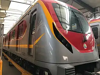 Train of the Orange Line at a station.