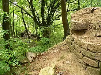 Remnants of the observation tower. Wall remnant with loophole at rear left