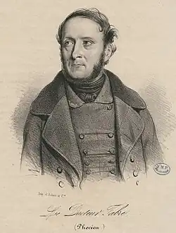 Man with a beard wearing a coat.