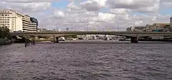 View of London Bridge from a boat passing under Cannon Street Railway Bridge