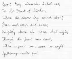 The first verse of "Good King Wenceslas" in cursive