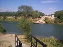 Los Ebanos Ferry as seen from Mexico in 1999. The US Border Inspection Station is on the opposite shore
