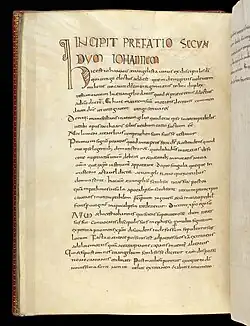 Folio 77v. The beginning of the preface to John, with a decorated initial 'H' and with colored letters.