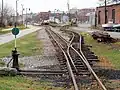 The rear of the office building (left of center) is in view in this 2016 image of the Maine Narrow Gauge Railroad from the Eastern Promenade Trail