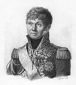 Black and white print shows a curly-haired and clean-shaven man wearing a highly embroidered military uniform.